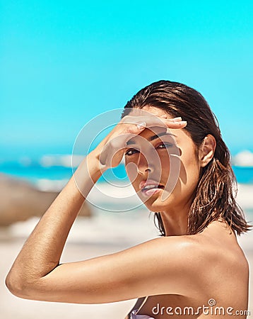 Portrait, beach and woman with sunshine, travel and summer holiday on a break, relax and beauty. Face, female traveler Stock Photo