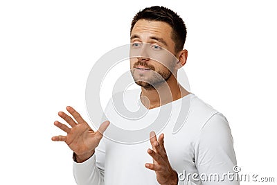 Portrait of bearded man in casual white shirt telling something Stock Photo