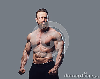 Portrait of bearded shirtless bodybuilder. Stock Photo