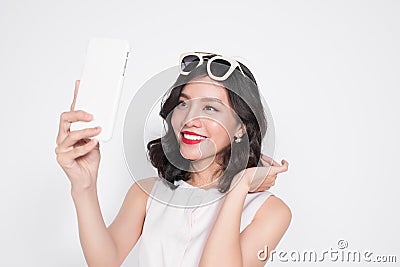 Portrait of beautiful asian fashionable girl taking selfie Stock Photo