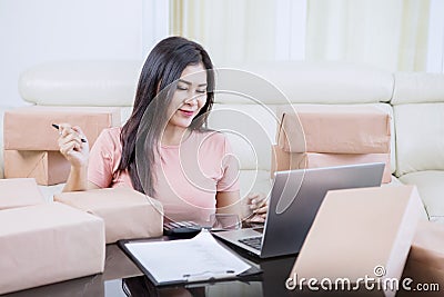 Beautiful Asian woman finished her calculations Stock Photo