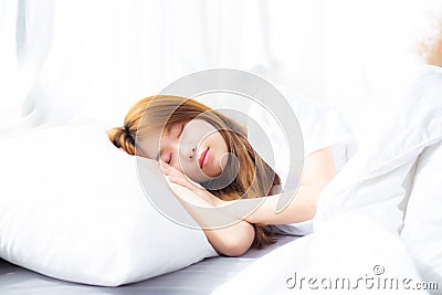 Portrait of beautiful asian young woman sleep lying in bed with head on pillow comfortable and happy with leisure. Stock Photo