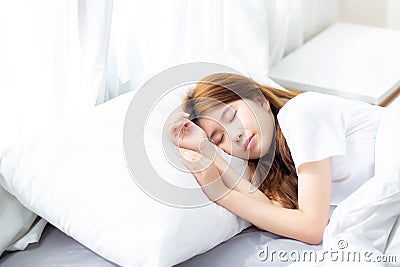 Portrait of beautiful asian young woman sleep lying in bed with head on pillow comfortable and happy with leisure. Stock Photo