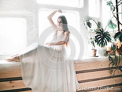 Portrait of beautiful balerina woman weared in white dress Stock Photo