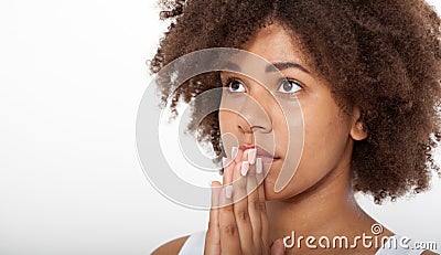 Portrait beautiful black woman praying, young girl with her hands together, closeup expression. Religion faith and Stock Photo