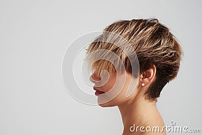 Beautiful blond woman with short hairstyle posing at studio Stock Photo