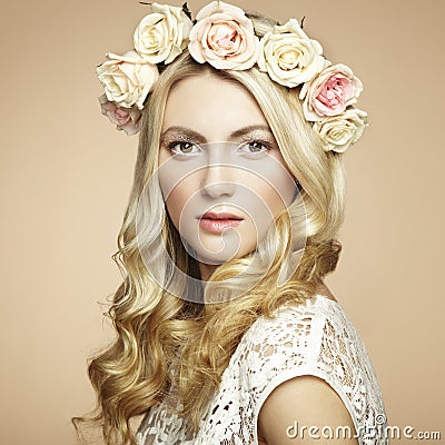 Portrait of a beautiful blonde woman with flowers in her hair Stock Photo