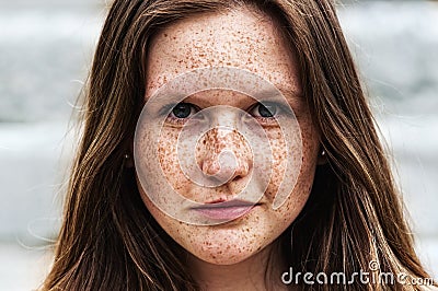 Portrait of a beautiful redhead girl with freckles Stock Photo