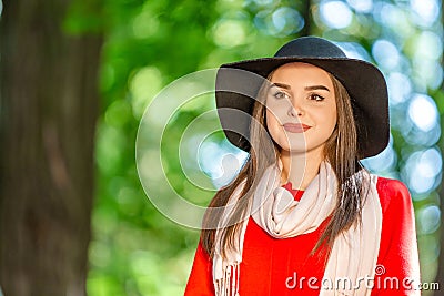 Portrait of a beautiful fashionable girl outdoor on sunny spring day, breating fresh air in park. Stock Photo