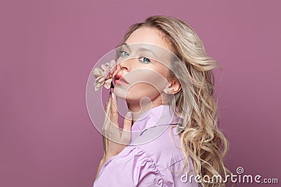 Portrait of beautiful female model on pink background Stock Photo