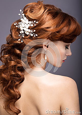 Portrait of a beautiful ginger woman in the image of the bride. Stock Photo