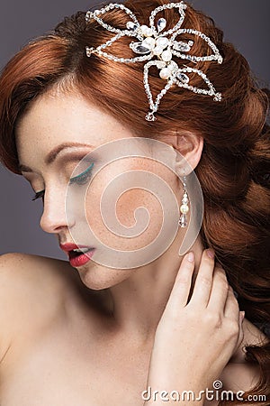 Portrait of a beautiful ginger woman in the image of the bride. Stock Photo