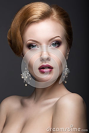 Portrait of a beautiful ginger woman in the image of the bride. Stock Photo