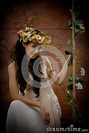 Portrait of beautiful girl in antique dress Stock Photo