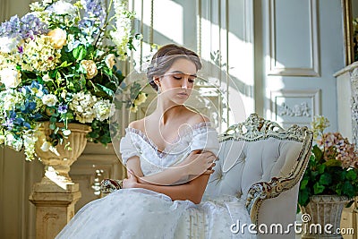 Portrait of a beautiful girl in a ball gown in the interior. Concept of tenderness and pure beauty in sweet princess look. Beautif Stock Photo