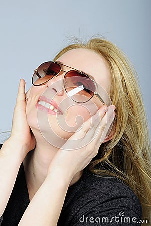 Portrait of the beautiful girl bespectacled Stock Photo