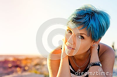 A portrait of beautiful girl with blue hair in sailor's striped Stock Photo