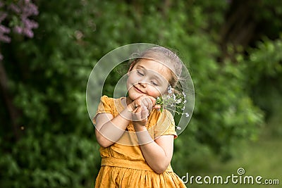 Portrait of a beautiful girl with a bouquet of forget-me-nots Stock Photo