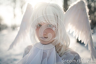 Portrait of beautiful girl in image of good angel with wings Stock Photo