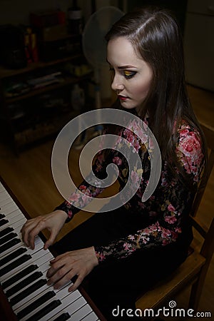 Portrait of a beautiful girl piano Stock Photo