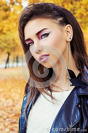 Portrait of a beautiful girl in rock style with bright makeup Stock Photo