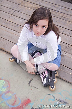 Portrait of beautiful girl with skates Stock Photo