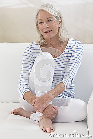 Portrait of a beautiful mature senior woman looking at camera Stock Photo