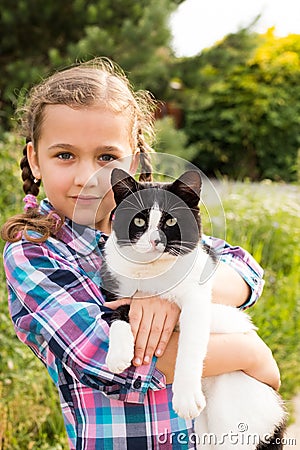 Mixed Breed Of Cat In Child Hands Embrace Of Little Russian Girl Stock Photo