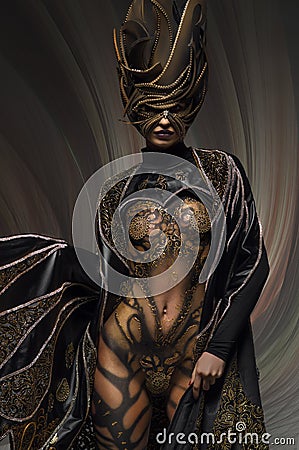 Portrait of beautiful model with fantasy golden butterfly body art Stock Photo