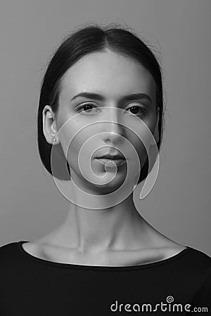 Portrait of a beautiful pacified woman in a black blouse and with medium short hair. Studio photo session Stock Photo