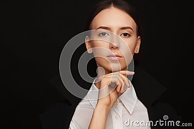 Portrait of a beautiful pacified woman in a white shirt and black jacket. Studio photo session Stock Photo