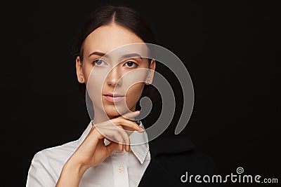 Portrait of a beautiful pacified woman in a white shirt and black jacket. Studio photo session Stock Photo