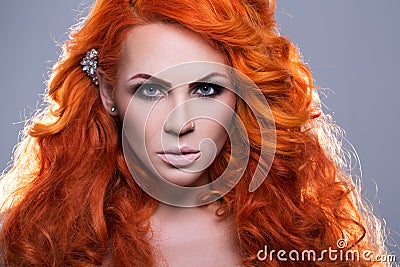Portrait of beautiful red-haired woman Stock Photo