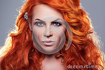 Portrait of beautiful red-haired woman Stock Photo