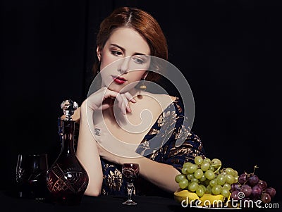 Portrait of beautiful rich women with grapes. Stock Photo