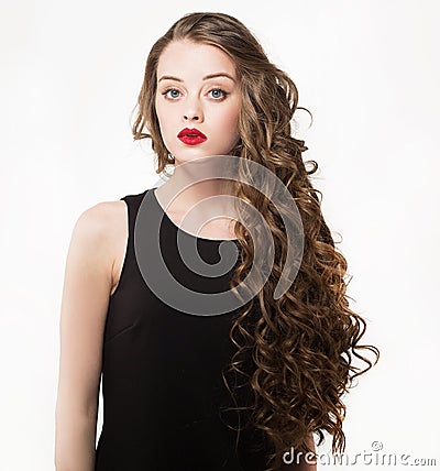 Portrait of a beautiful sensuality woman in black dress with long curly hair Stock Photo