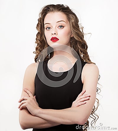 Portrait of a beautiful sensuality woman in black dress with long curly hair Stock Photo