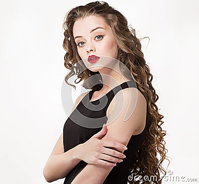 Portrait of a beautiful sensuality woman in black dress with long curly hair Stock Photo