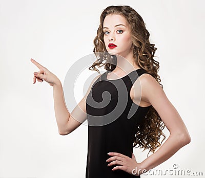 Portrait of a beautiful sensuality woman in black dress with long curly hair Stock Photo