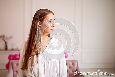 Portrait of a beautiful sensuality young woman with long blonde hair wearing a shirt Stock Photo