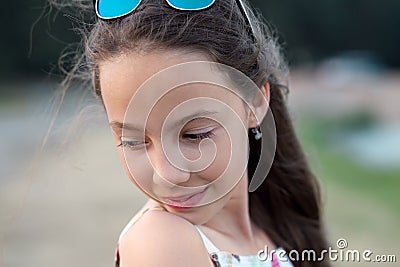 Portrait of beautiful serious teenager girl, looking down Stock Photo