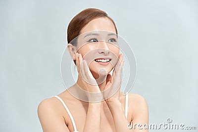Portrait of Beautiful Skin care woman enjoy and happy, touching her face Stock Photo