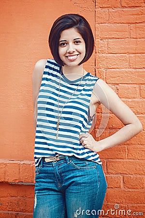 Portrait of beautiful smiling young hipster latin hispanic girl woman with short hair bob Stock Photo