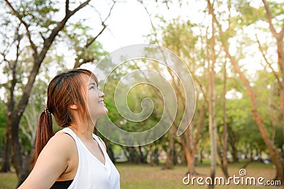 Portrait of beautiful smiling young woman enjoying yoga, relaxing, feeling alive, breathing fresh air, got freedom from work. Stock Photo