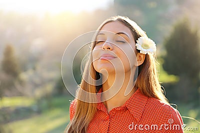 Portrait of beautiful smiling young woman enjoying yoga, relaxing, feeling alive, breathing fresh air, got freedom from work or Stock Photo