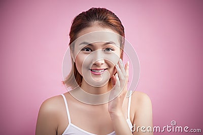 Portrait of a beautiful smiling young woman with natural make-up. Skincare, healthcare. Healthy teeth. Studio shot. Isolated on P Stock Photo