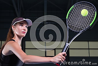 Portrait of a beautiful tennis player training on the court. Sports concept Stock Photo