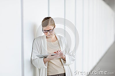 Portrait of beautiful woman blonde using tablet. Stock Photo