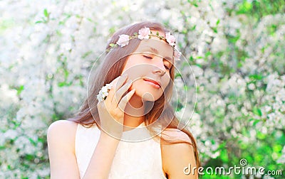 Portrait beautiful woman with floral headband and petals of flowers Stock Photo