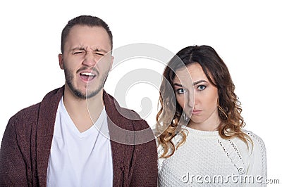 Portrait of beautiful woman and man making facial expressions Stock Photo